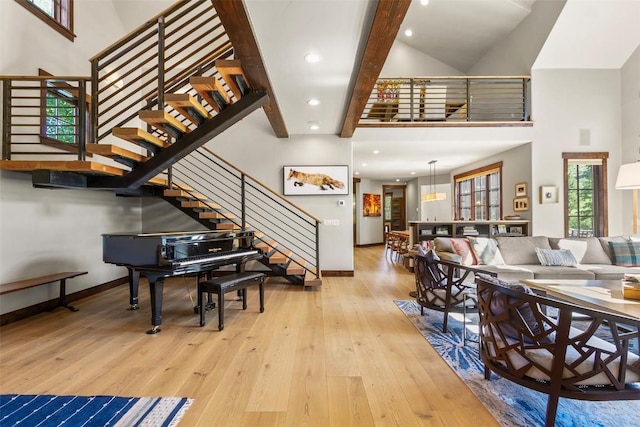 228 Cottonwood Cir, Breckenridge, CO 80424 - living room with a high ceiling, stairs, wood-type flooring, beam ceiling, and recessed lighting