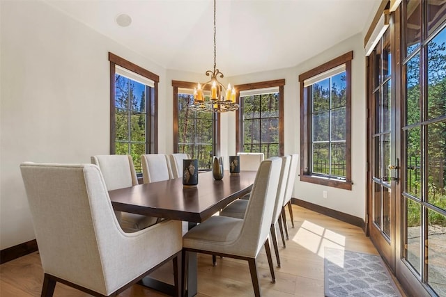 228 Cottonwood Cir, Breckenridge, CO 80424 - dining room with a chandelier and light wood-style floors