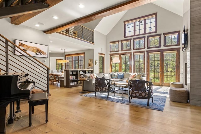 228 Cottonwood Cir, Breckenridge, CO 80424 - living area with high vaulted ceiling, hardwood / wood-style floors, plenty of natural light, stairway, and beam ceiling