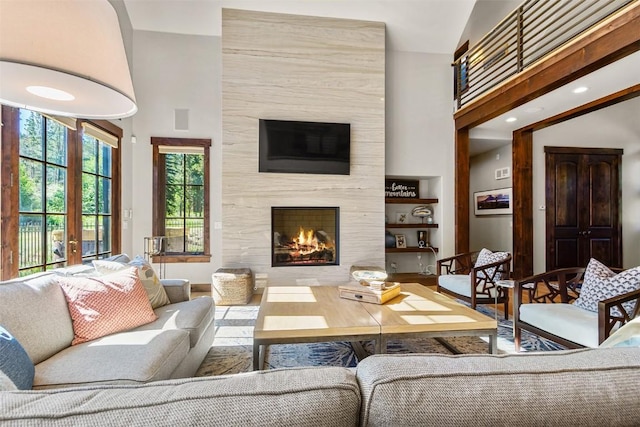 228 Cottonwood Cir, Breckenridge, CO 80424 - living area featuring a fireplace, wood finished floors, and a high ceiling