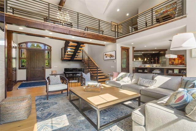 228 Cottonwood Cir, Breckenridge, CO 80424 - living area featuring a high ceiling, stairs, wood finished floors, and recessed lighting