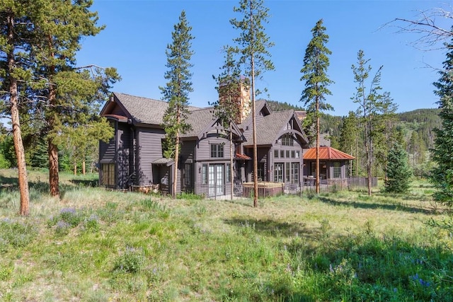 228 Cottonwood Cir, Breckenridge, CO 80424 - rear view of property with a chimney