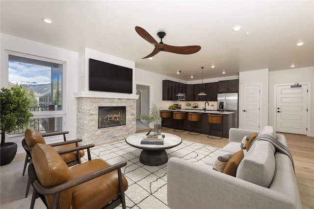 0125 W Keystone Rd Unit 301, Keystone, CO 80435 - living room featuring a ceiling fan, light wood-style floors, recessed lighting, and a fireplace