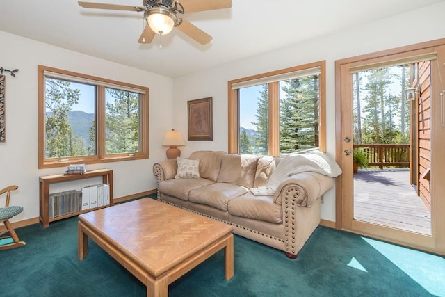440 Gcr 466, Grand Lake, CO 80447 - carpeted living area with plenty of natural light, ceiling fan, and baseboards
