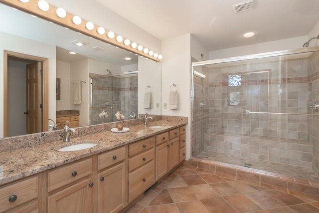 440 Gcr 466, Grand Lake, CO 80447 - full bathroom featuring a stall shower, double vanity, tile patterned floors, and recessed lighting