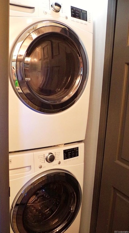 2515 Apres Ski Way Unit 5, Steamboat Springs, CO 80487 - laundry room featuring stacked washing machine and dryer
