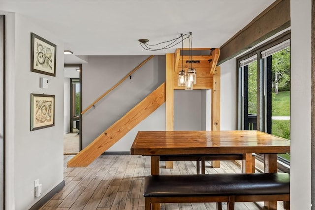 2515 Apres Ski Way Unit 5, Steamboat Springs, CO 80487 - dining space featuring wood finished floors, stairs, and baseboards
