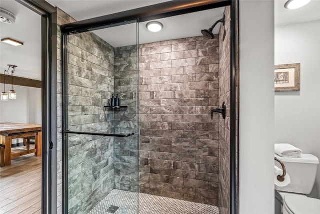 2515 Apres Ski Way Unit 5, Steamboat Springs, CO 80487 - bathroom with a stall shower, wood finished floors, and toilet