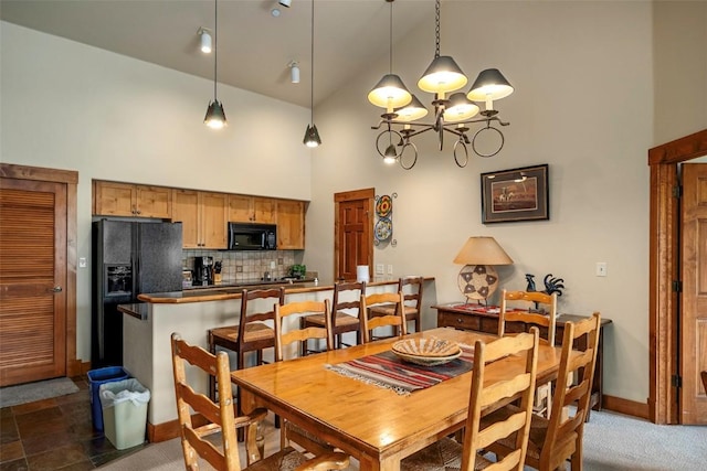 2920 Village Dr Unit 2301, Steamboat Springs, CO 80487 - dining room featuring high vaulted ceiling and a chandelier