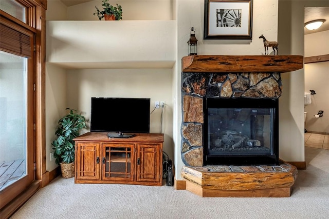 2920 Village Dr Unit 2301, Steamboat Springs, CO 80487 - living room featuring carpet floors and a stone fireplace