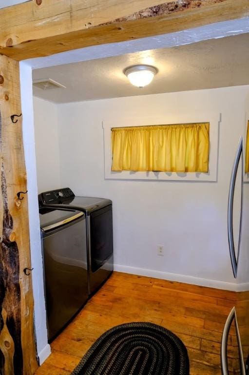 436 Clifton Ave, Yampa, CO 80483 - laundry area with wood-type flooring, baseboards, and washer and dryer