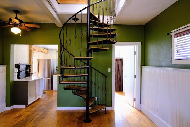 436 Clifton Ave, Yampa, CO 80483 - staircase featuring hardwood / wood-style floors, a ceiling fan, baseboards, and beamed ceiling