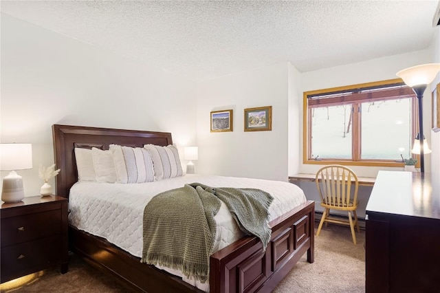 carpeted bedroom with a textured ceiling