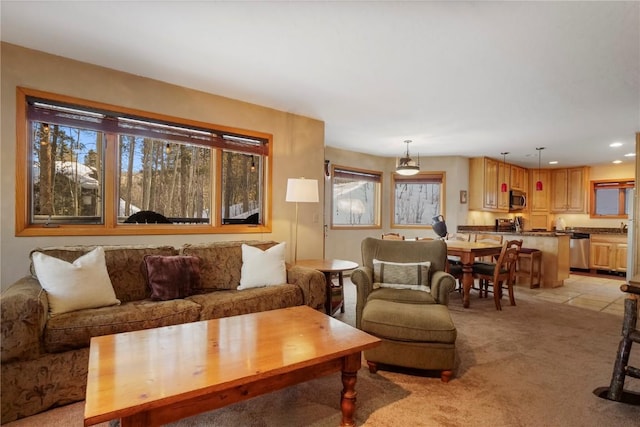 living room with light colored carpet, a wealth of natural light, and recessed lighting