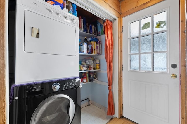 625 Amethyst Dr, Steamboat Springs, CO 80487 - laundry room featuring stacked washer / drying machine and light floors