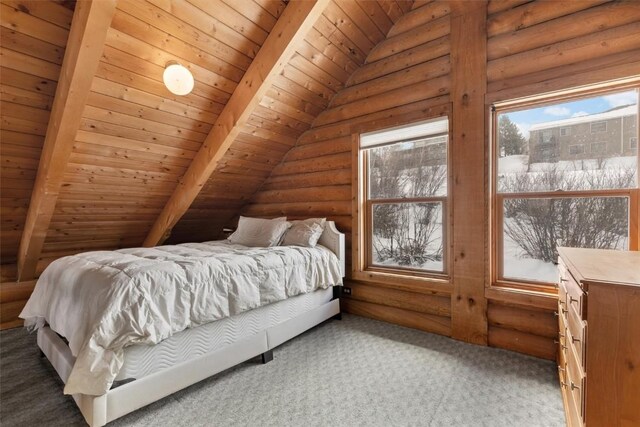 625 Amethyst Dr, Steamboat Springs, CO 80487 - carpeted bedroom with rustic walls, multiple windows, and wood ceiling