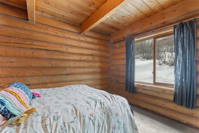 625 Amethyst Dr, Steamboat Springs, CO 80487 - bedroom with multiple windows, wooden ceiling with exposed beams, rustic walls, and carpet flooring
