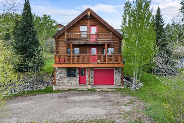 625 Amethyst Dr, Steamboat Springs, CO 80487 - log cabin featuring log exterior, stone siding, and a balcony