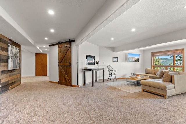 192 Nova Dr, Pine, CO 80470 - living room featuring a barn door, carpet, and recessed lighting
