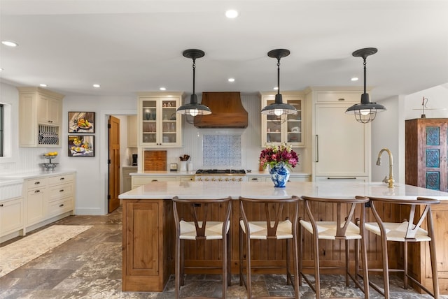 192 Nova Dr, Pine, CO 80470 - kitchen featuring custom exhaust hood, light countertops, tasteful backsplash, glass insert cabinets, and recessed lighting
