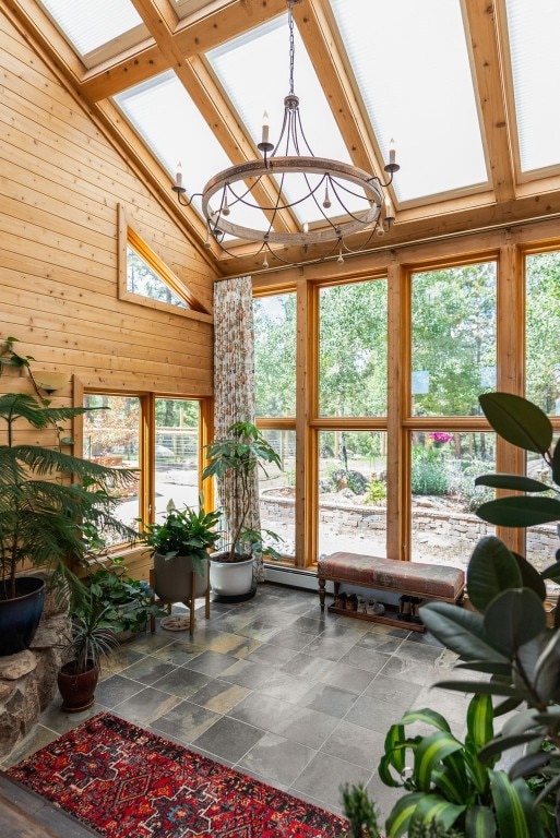 192 Nova Dr, Pine, CO 80470 - sunroom / solarium with high vaulted ceiling, wooden walls, stone finish flooring, and beam ceiling