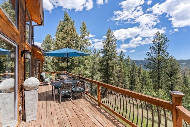 192 Nova Dr, Pine, CO 80470 - wooden terrace featuring a view of trees
