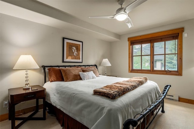 435 Ore House Plz Unit 301, Steamboat Springs, CO 80487 - bedroom featuring light colored carpet, baseboard heating, and ceiling fan