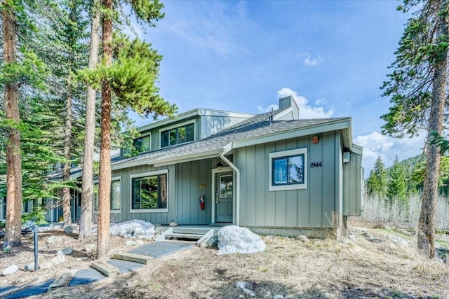 1944 Soda Ridge Rd Unit 1231, Keystone, CO 80435 - view of front of property featuring a shingled roof, a chimney, and board and batten siding