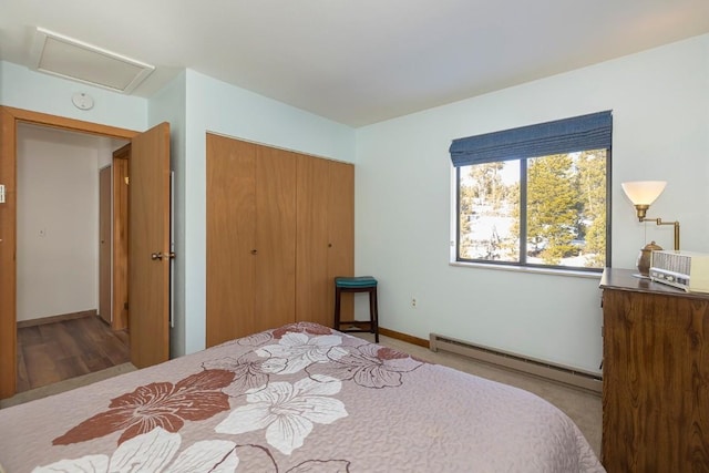 122 Gcr 442 Unit 2B, Grand Lake, CO 80447 - bedroom featuring a baseboard heating unit, a closet, baseboards, and attic access