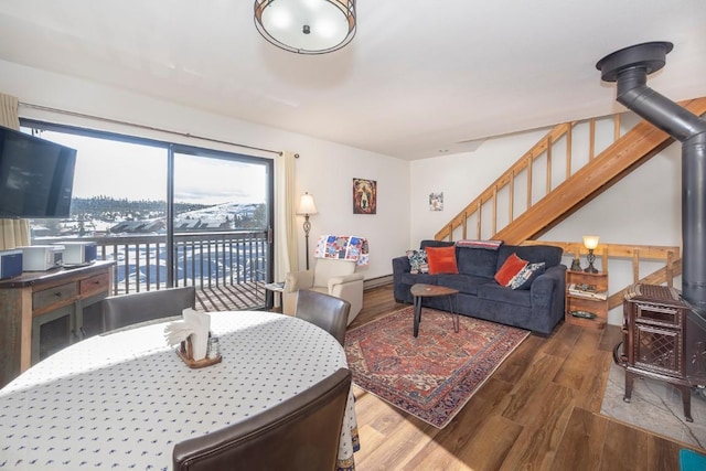 122 Gcr 442 Unit 2B, Grand Lake, CO 80447 - living room featuring wood finished floors, stairs, and a wood stove