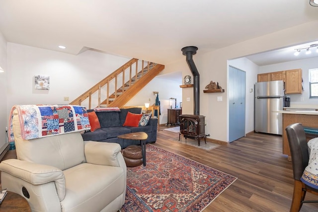 122 Gcr 442 Unit 2B, Grand Lake, CO 80447 - living room with stairway, a wood stove, dark wood finished floors, baseboards, and recessed lighting