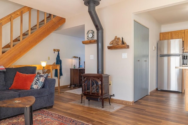 122 Gcr 442 Unit 2B, Grand Lake, CO 80447 - living area with wood finished floors, stairs, and a wood stove
