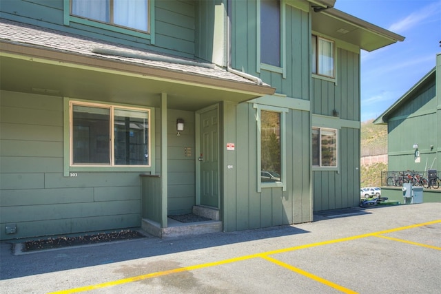 1153 Straight Creek Dr Unit 204, Dillon, CO 80435 - doorway to property with board and batten siding and uncovered parking