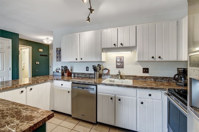 1153 Straight Creek Dr Unit 204, Dillon, CO 80435 - kitchen with appliances with stainless steel finishes, a sink, white cabinetry, and light tile patterned floors