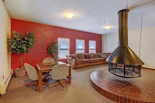1153 Straight Creek Dr Unit 204, Dillon, CO 80435 - dining area featuring a baseboard heating unit, a textured ceiling, and carpet flooring