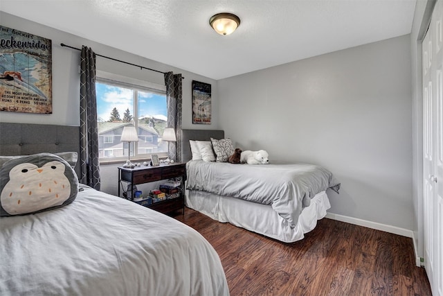 1153 Straight Creek Dr Unit 204, Dillon, CO 80435 - bedroom featuring wood finished floors and baseboards