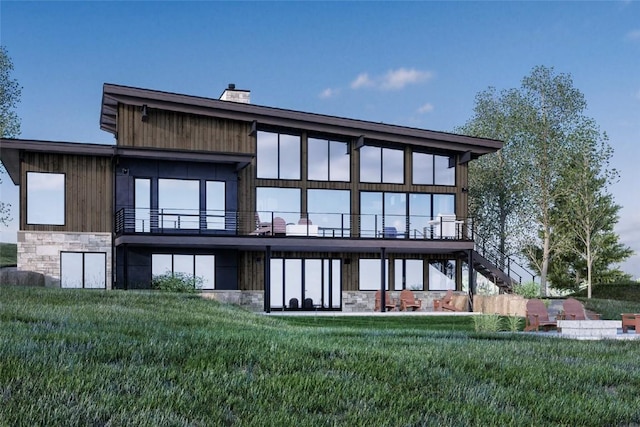 971 Steamboat Blvd, Steamboat Springs, CO 80487 - back of house featuring stone siding, stairway, and a yard