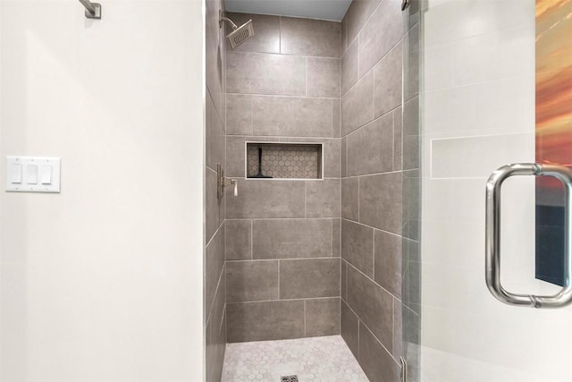 full bath with a shower stall