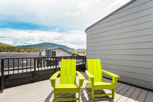 wooden terrace featuring a mountain view
