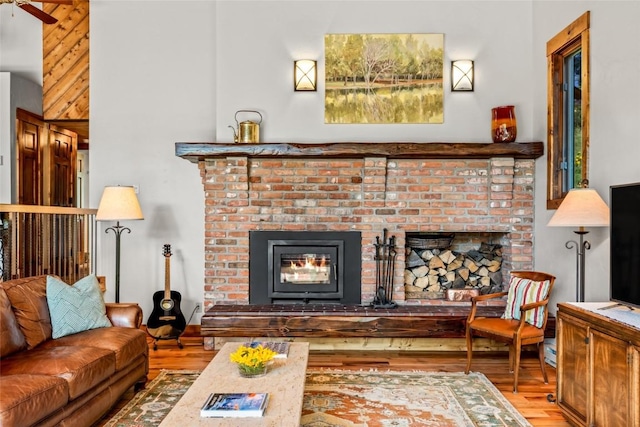 31650 Mt Werner Rd, Steamboat Springs, CO 80487 - living area with wood finished floors and a fireplace