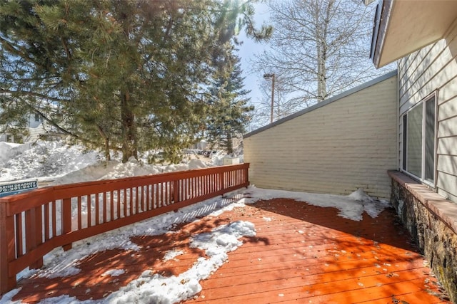 view of snow covered deck