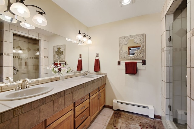 112 N Pine St, Breckenridge, CO 80424 - full bath with baseboard heating, double vanity, a shower stall, tile patterned flooring, and baseboards