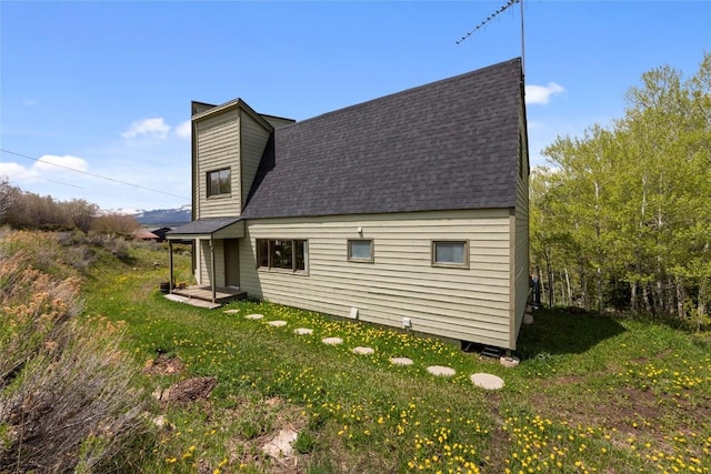 71 Barking Dog Rd, Silverthorne, CO 80498 - view of home's exterior featuring a yard and a shingled roof