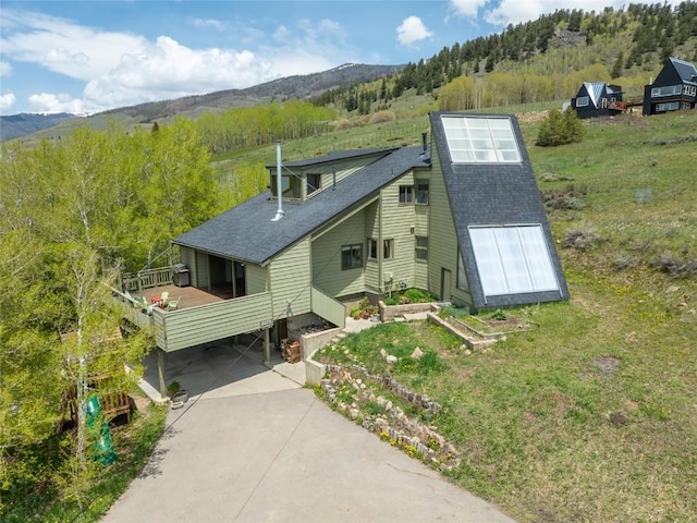 71 Barking Dog Rd, Silverthorne, CO 80498 - view of front of house with a shingled roof, a mountain view, and a wooded view