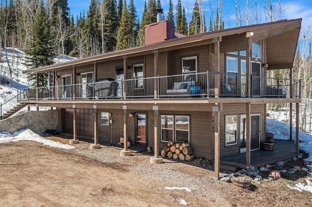 58195 Jupiter Pl, Clark, CO 80428 - snow covered house with a chimney and a balcony