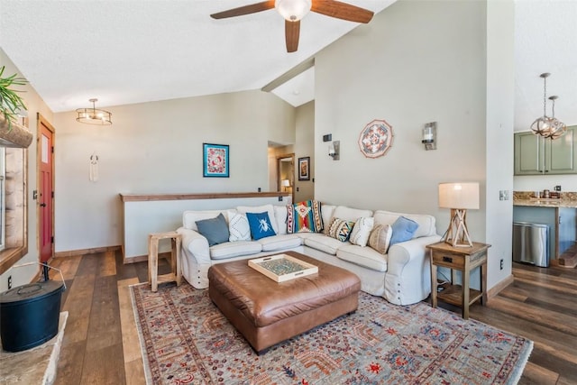 58195 Jupiter Pl, Clark, CO 80428 - living area featuring baseboards, vaulted ceiling, ceiling fan, and dark wood-style flooring