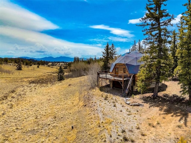 902 Hawk Way, Como, CO 80456 - view of yard featuring a deck with mountain view, stairway, and a view of countryside