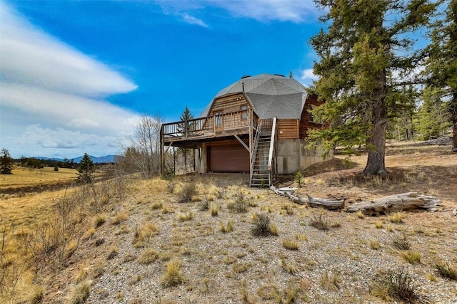 902 Hawk Way, Como, CO 80456 - view of outdoor structure featuring a garage, a mountain view, and stairway