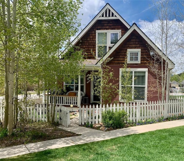 38 Huckleberry Grn, Breckenridge, CO 80424 - view of front of house with covered porch and a fenced front yard