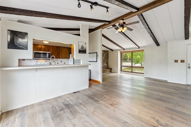 361 Lagoon Ln, Silverthorne, CO 80498 - unfurnished living room with wood finished floors, ceiling fan, and baseboards